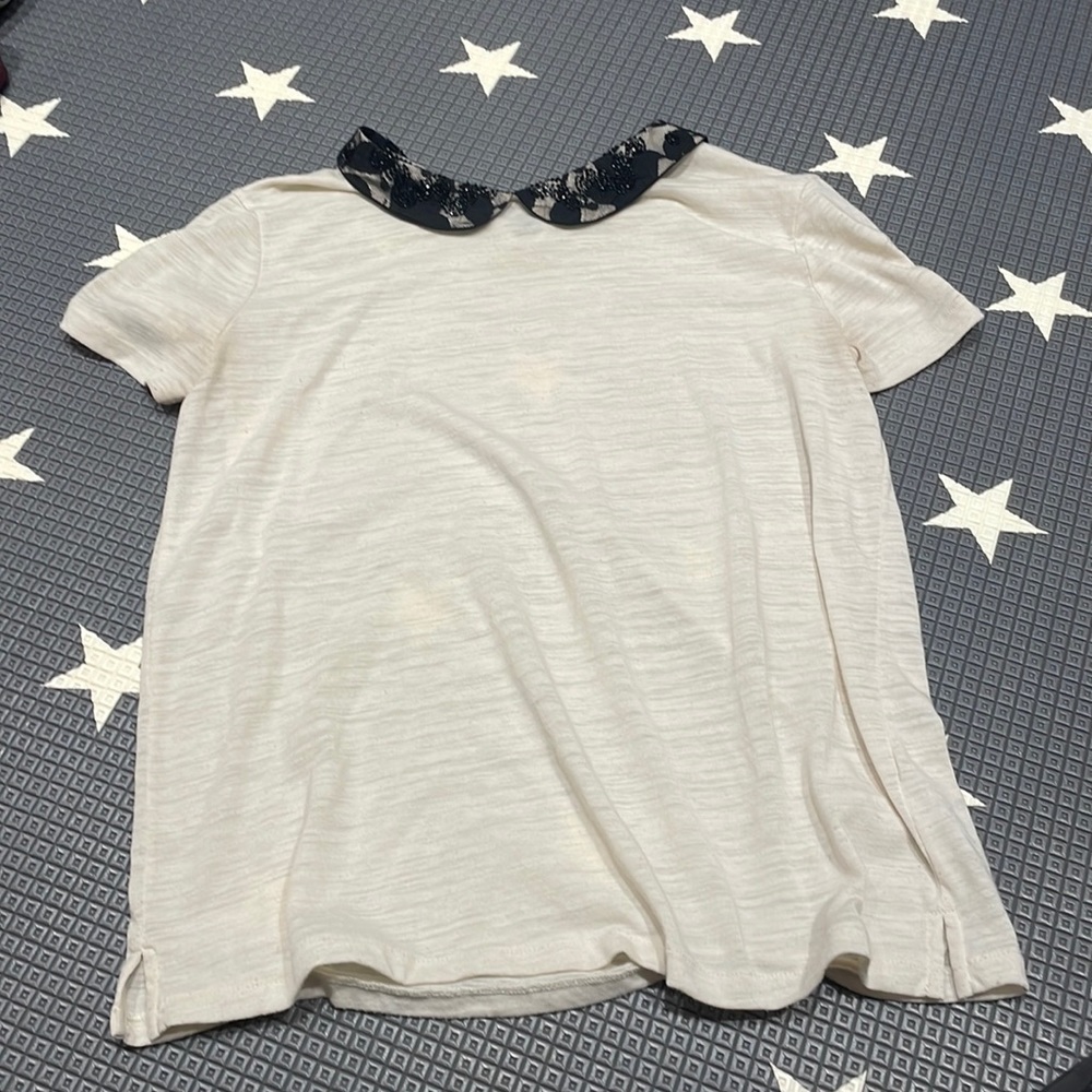 Cream collared t shirt with black sequin collar